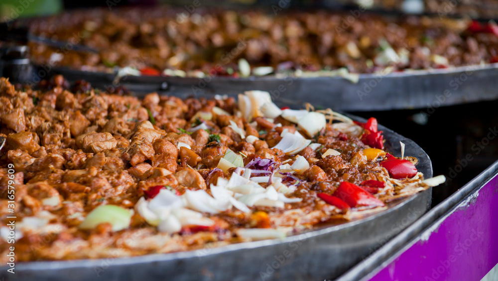 Pakistani cuisine Street food - rice, curry and bread selection. Pakistani cuisine Street food - rice, curry and bread selection.