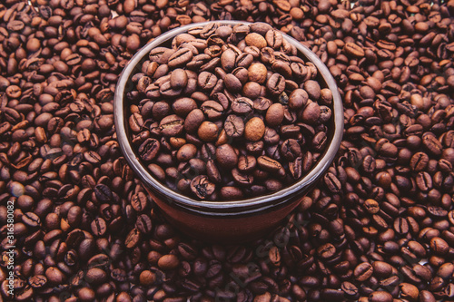 full bowl of roasted coffee beans