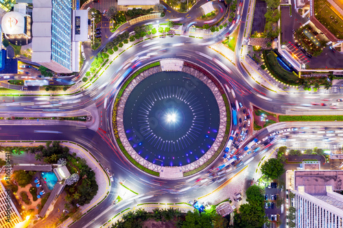 Hotel Indonesia with traffic jam nearby at night