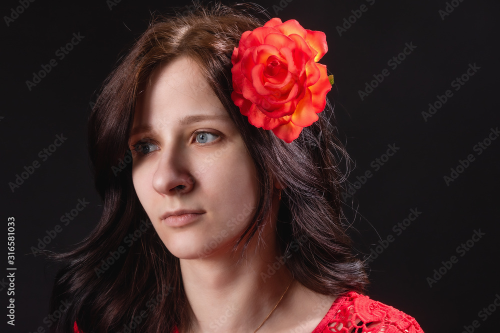 Portrait of girl without makeup with flower in her hair in retro 20's style Portrait of girl without makeup with flower in her hair in retro 20's style