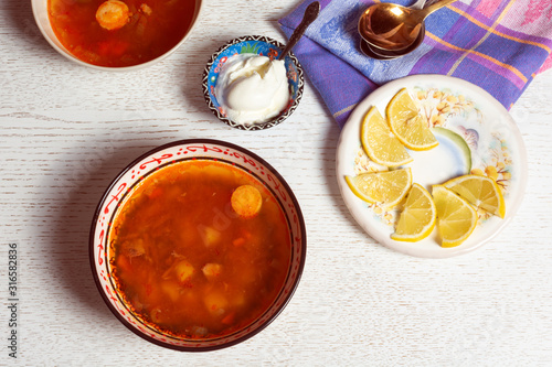 Billede på lærred Top horizontal view of hodgepodge soup made of various ingredients serving with