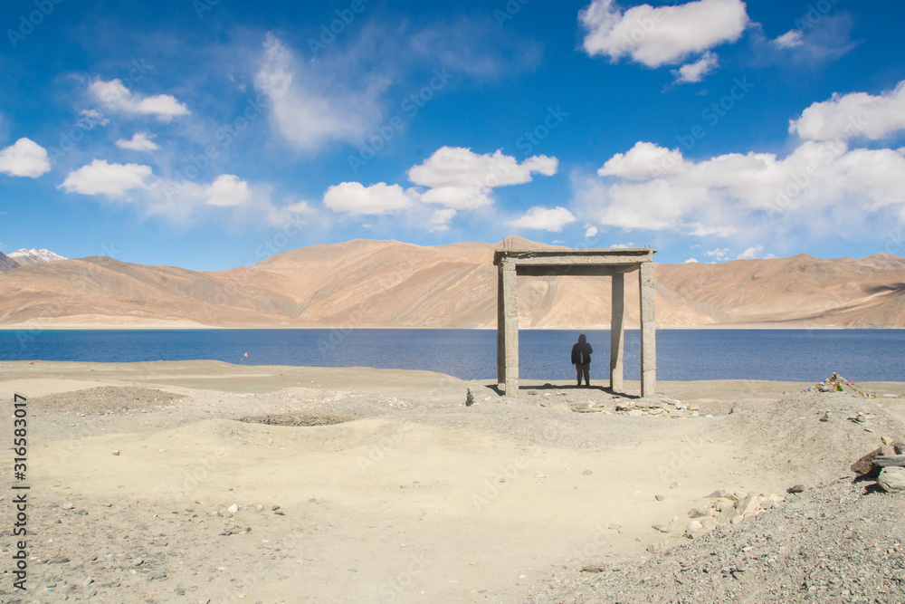 Man in Pangong Tso lake in Ladakh, India