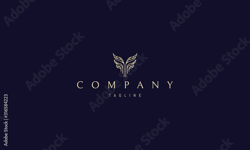 Vector golden logo on which an abstract image of leaves that resemble a column.