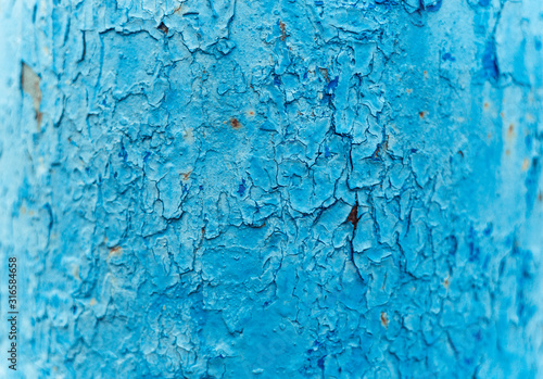 Old Rusty painted metal background. Blue Peeling paint texture.