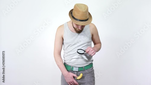 Inspection of the penis through a magnifying glass.Small penis problem men.