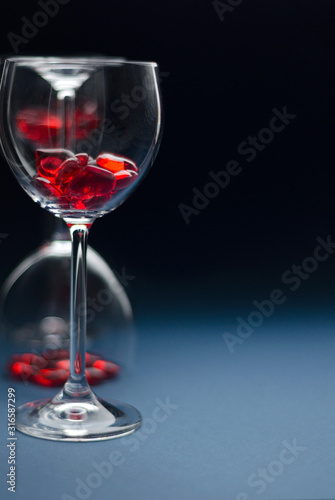 Wallpaper Mural Valentine's day concept, Love concept, Wine glass for a wine filled with hearts on a blue background. Back light. Soft blurred focus Torontodigital.ca