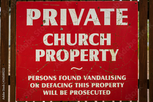 Sign: Private Church Property, Persons found vandalising or defacing this property will be prosecuted