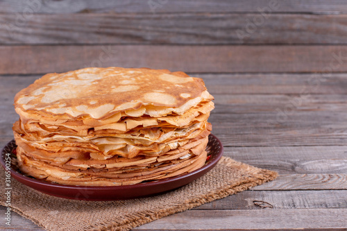 Stack of thin pancakes in a plate