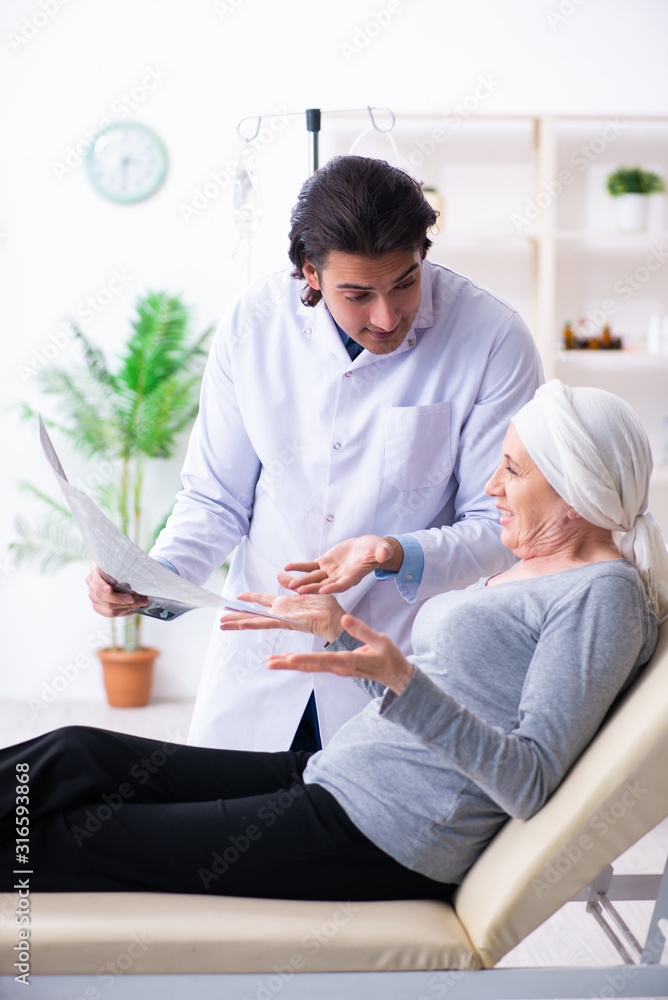 Young male doctor and female oncology patient Young male doctor and female oncology patient