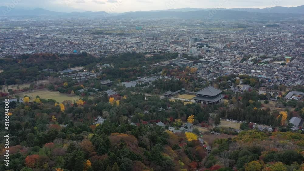 Aerial view of Buddhist temple Todaiji (Tōdai-ji) in city of Nara (Nara Park), one of Japan's most famous and historically significant temples in autumn - landscape panorama of Japan from above, Asia Aerial view of Buddhist temple Todaiji (Tōdai-ji) in city of Nara (Nara Park), one of Japan's most famous and historically significant temples in autumn - landscape panorama of Japan from above, Asia