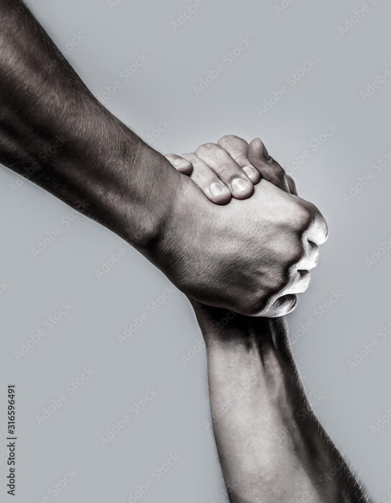 Rescue, helping hand. Two hands, helping hand of a friend. Black and white. Man help hands, guardianship, protection. Handshake, arms. Friendly handshake, friends greeting - obrazy, fototapety, plakaty 