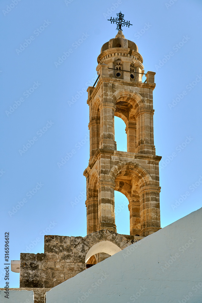 The stone tower of the Byzantine church and in Lindos on the island of Rhodes.