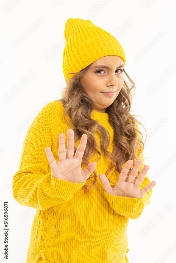 Happy caucasian girl in yellow hat and hoody refuses isolated on white background Happy caucasian girl in yellow hat and hoody refuses isolated on white background