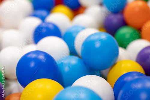 texture of multi-colored plastic balls for the background. close-up, background in blur
