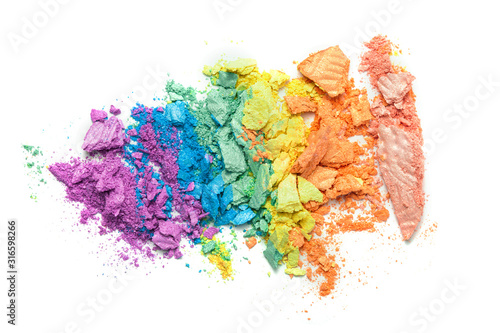 Fototapeta A broken rainbow colored eye shadow smear, make up palette isolated on a white background