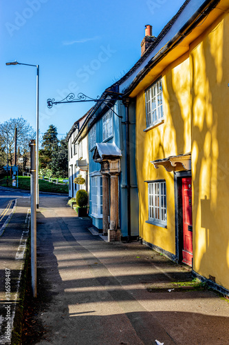 old yellow and blue houses