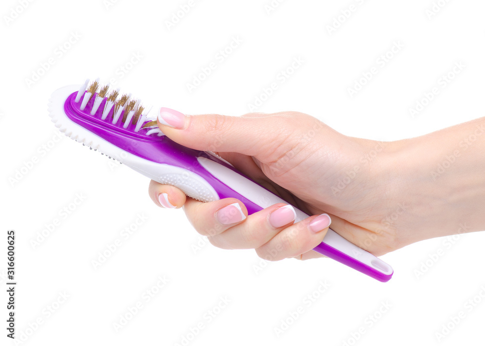 Shoe brush for cleaning shoes in hand on white background isolation Shoe brush for cleaning shoes in hand on white background isolation
