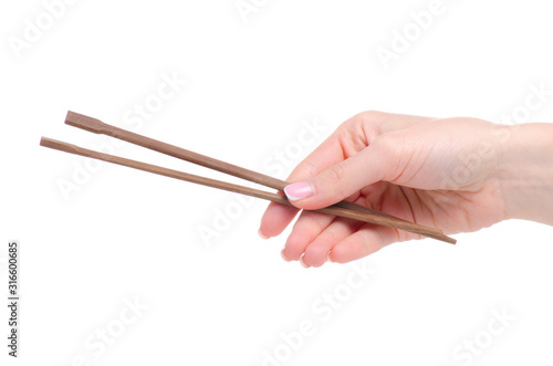 chopsticks in hand on a white background isolation