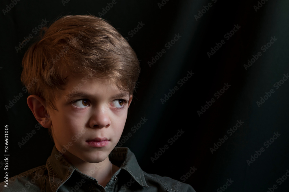 Portrait image of a small boy with brown eyes