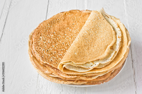 Stack of russian pancakes (crepes). Traditional Maslenitsa (Shrovetide) meal.