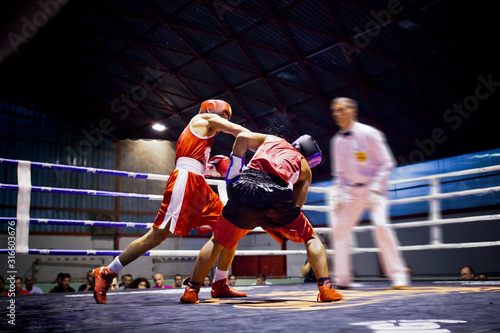 Two boxers fighting in a ring