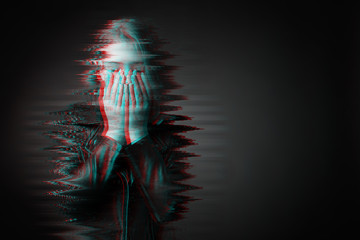 Black and white portrait of sad teenage girl on dark background