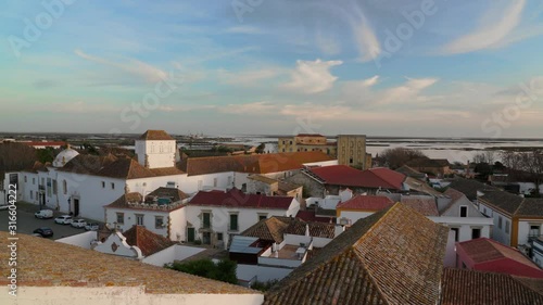 Sunset over the roofs of the old city of Faro. View from the church Largo de Se. Algarve Portugal.
