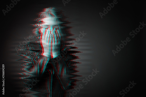 Black and white portrait of sad teenage girl on dark background