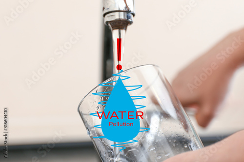 Woman filling glass with wa...