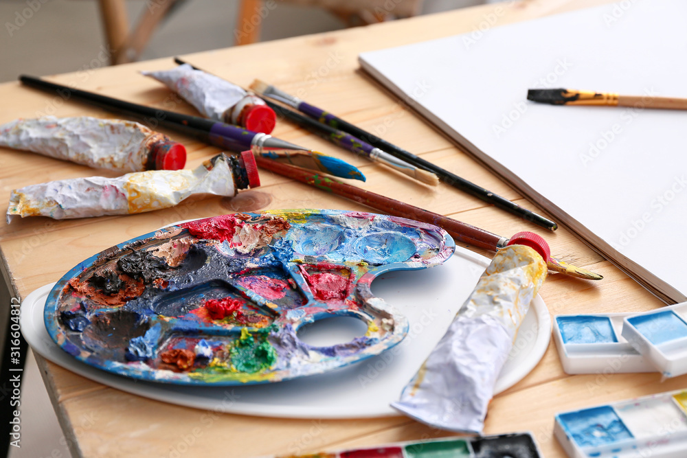 Set of artist's supplies on table Set of artist's supplies on table