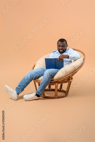 African-American man readin...