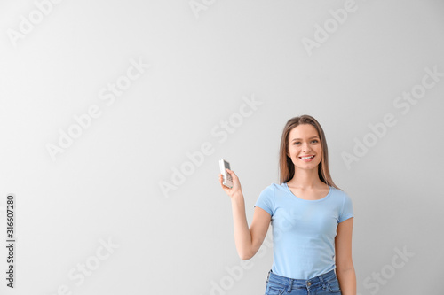 Young woman with air condit...