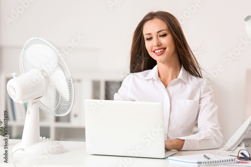 Young woman using electric ...