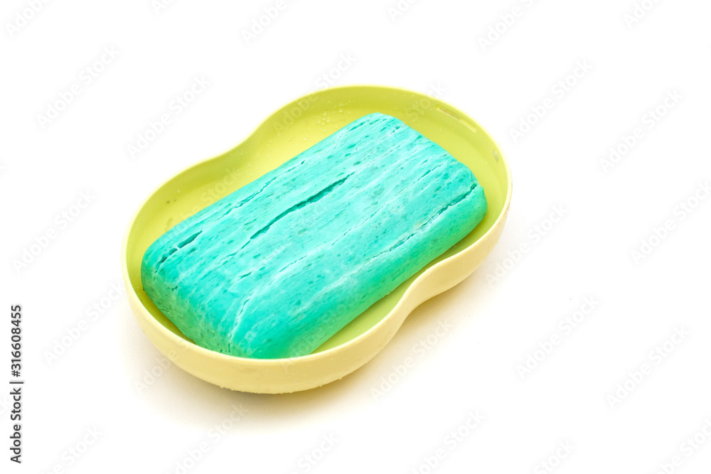 blue dry toilet soap with cracks on a white background blue dry toilet soap with cracks on a white background
