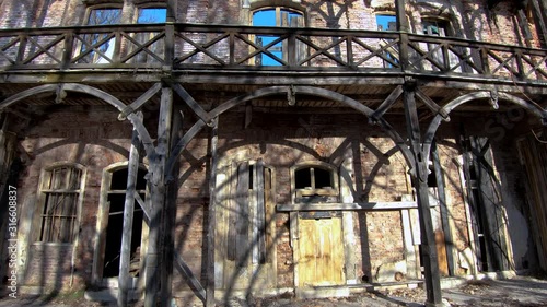 Wallpaper Mural Tilt up close up old wooden beams and balcony abandoned decayed villa Rikli at lake Bled, Slovenia. Ex sanatorium of Swiss healer Torontodigital.ca