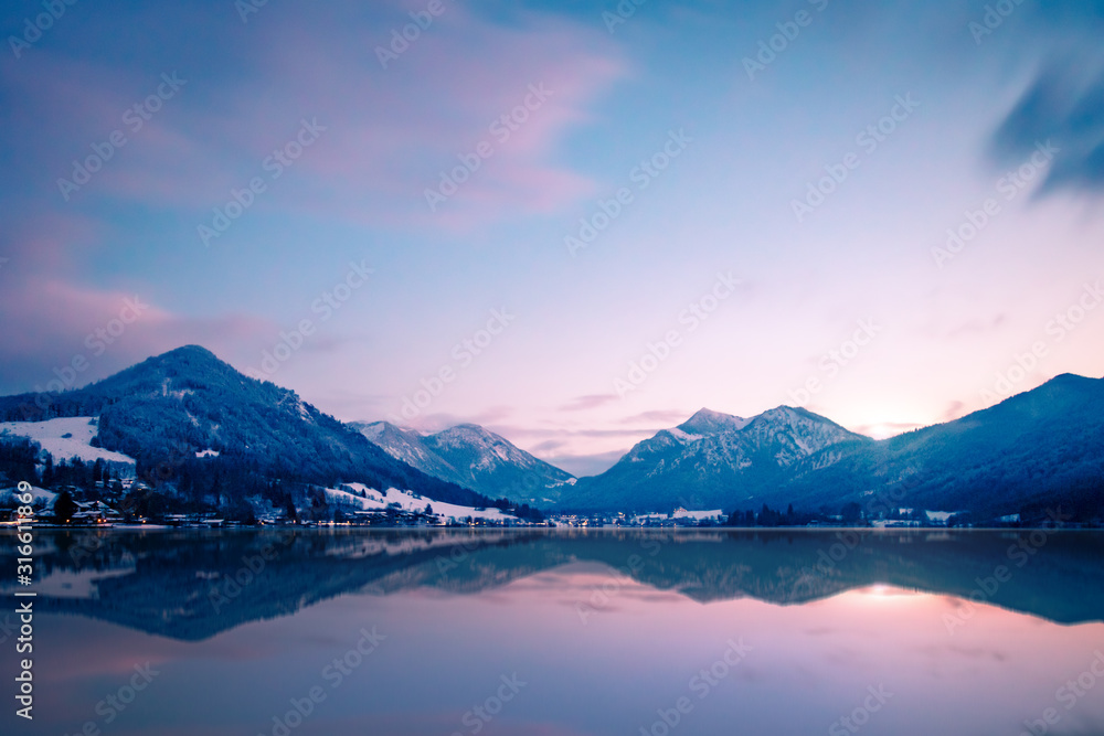 The beautiful lake Schliersee in the south of bavaria, germany, with mountains in the background, blue sky and nice reflections