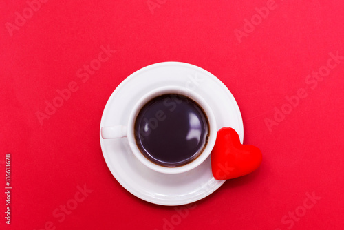 cup coffee with heart symbol on red background, valentine's day