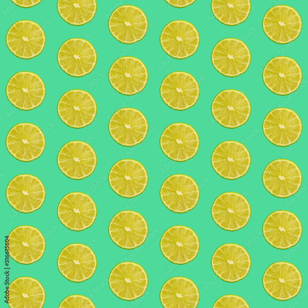Seamless pattern of limes on green background