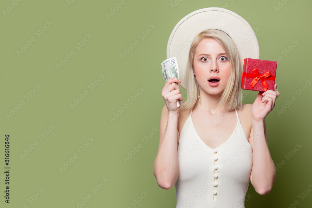 Beautiful blonde girl with money and gift box Beautiful blonde girl with money and gift box