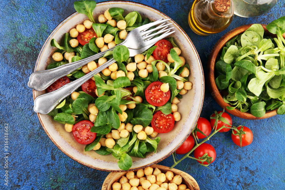 chickpea salad with ingredient and tomatoes and lamb´s lettuce. healthy salad chickpea salad with ingredient and tomatoes and lamb´s lettuce. healthy salad