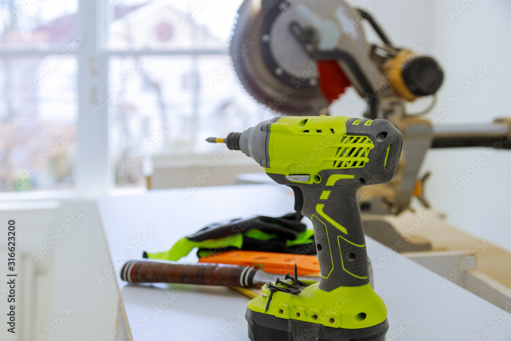 Electric screwdriver on the power tools construction site