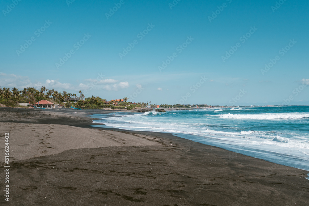 Seseh beach with a volcanic black sand non-touristic place in Bali, Indonesia
