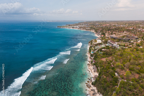 Most beautiful beach in Bali Padang Padang Beach with crystal clear azure water aerial view from drone