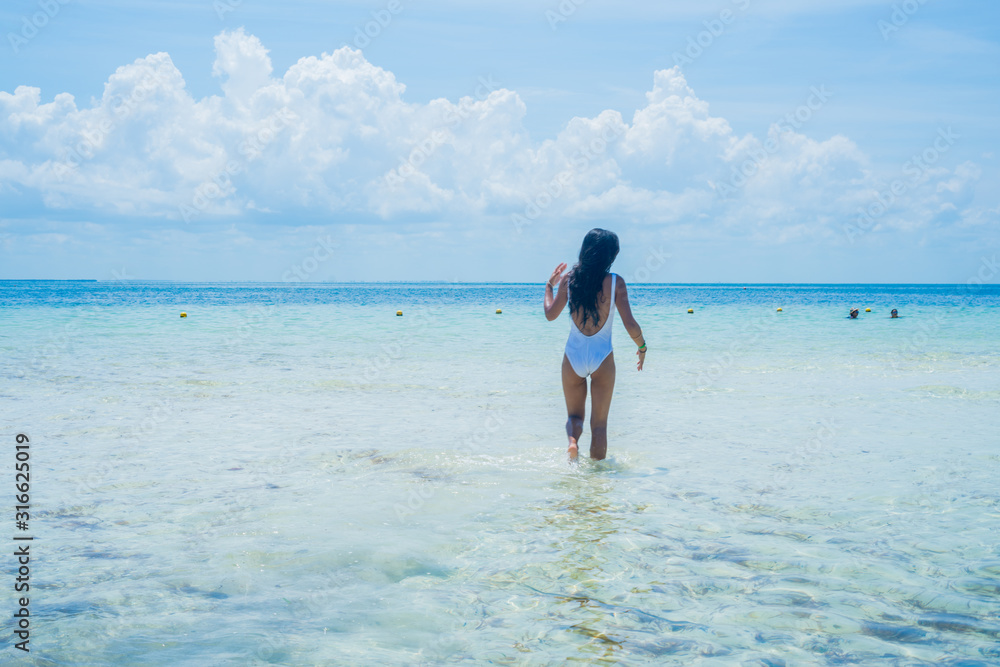 Young indian woman happy in the beach