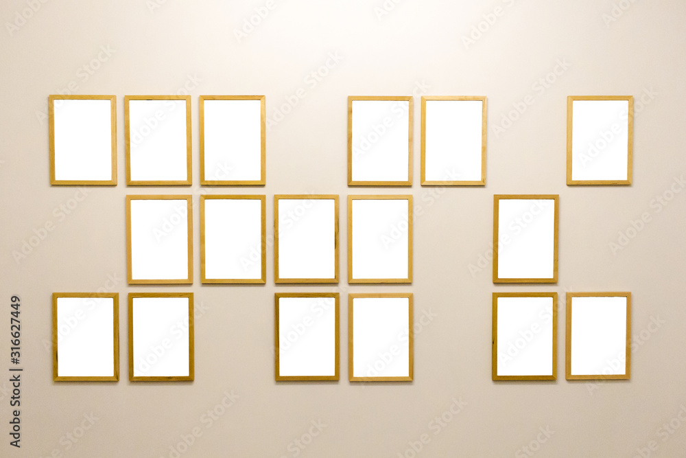 empty frames of wood on a light wall empty frames of wood on a light wall