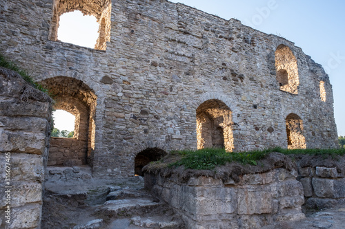 Old stone wall with windows, ruins of an ancient castle