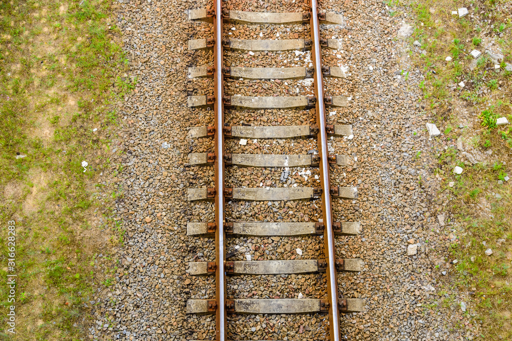 Top view of the railroad tracks on gravel Top view of the railroad tracks on gravel