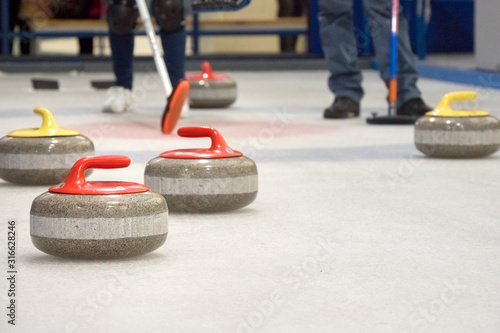 Group of stones for curlinggame in curling on ice.
