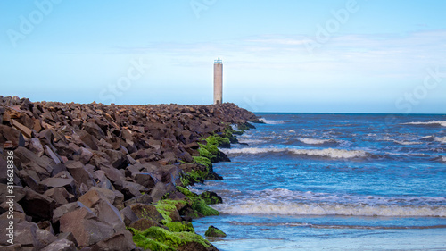 The Mampituba Lighthouse located in the city of Torres, in the state of Rio Grande do Sul photo