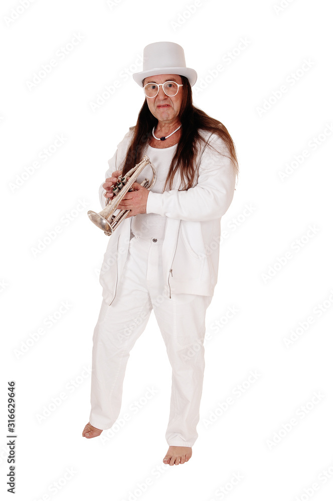 A trumpet player standing in a white outfit and hat A trumpet player standing in a white outfit and hat